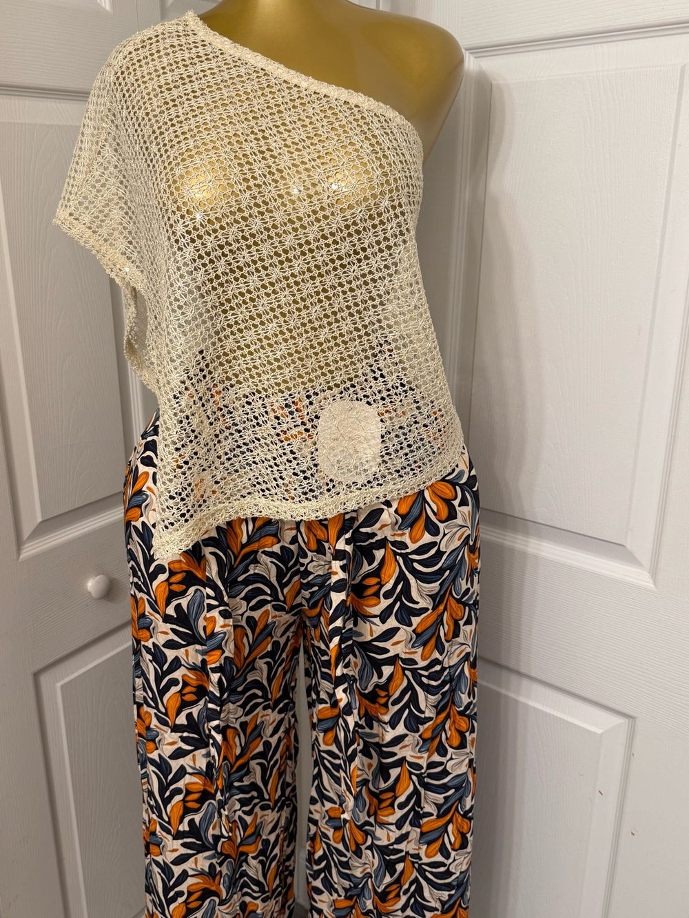 Cream Crochet One-Shoulder Top with Navy & Orange Floral Wide-Leg Pants